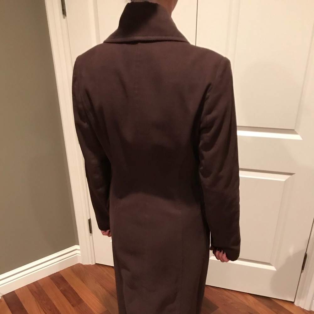 Full length brown trench coat.